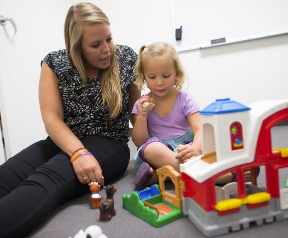 student working with child